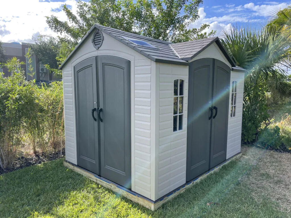 Gray outdoor storage shed assembled by David